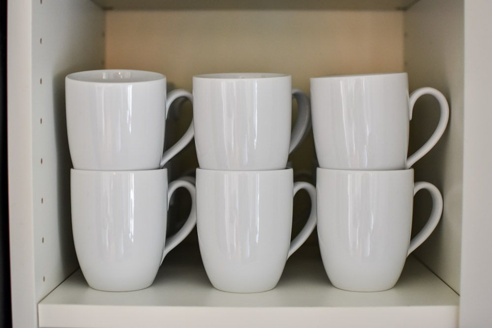 world market white mugs stacked on shelf