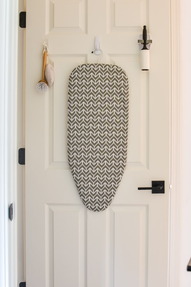 ironing board hanging on door