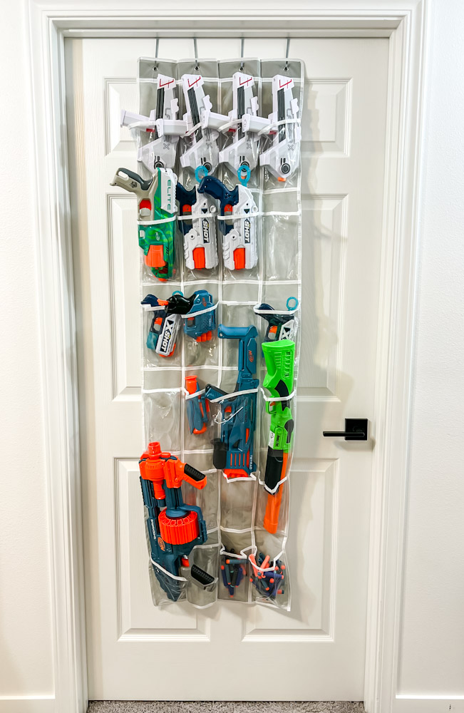 Organized Nerf Blasters in behind the door storage pockets