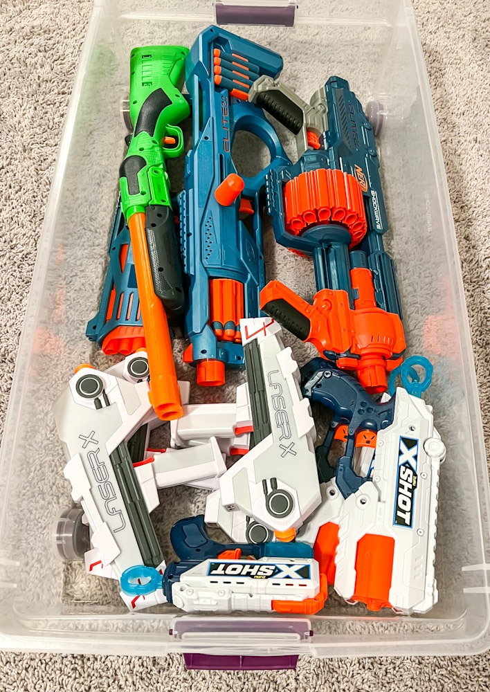 Nerf blasters stored in under the bed bin