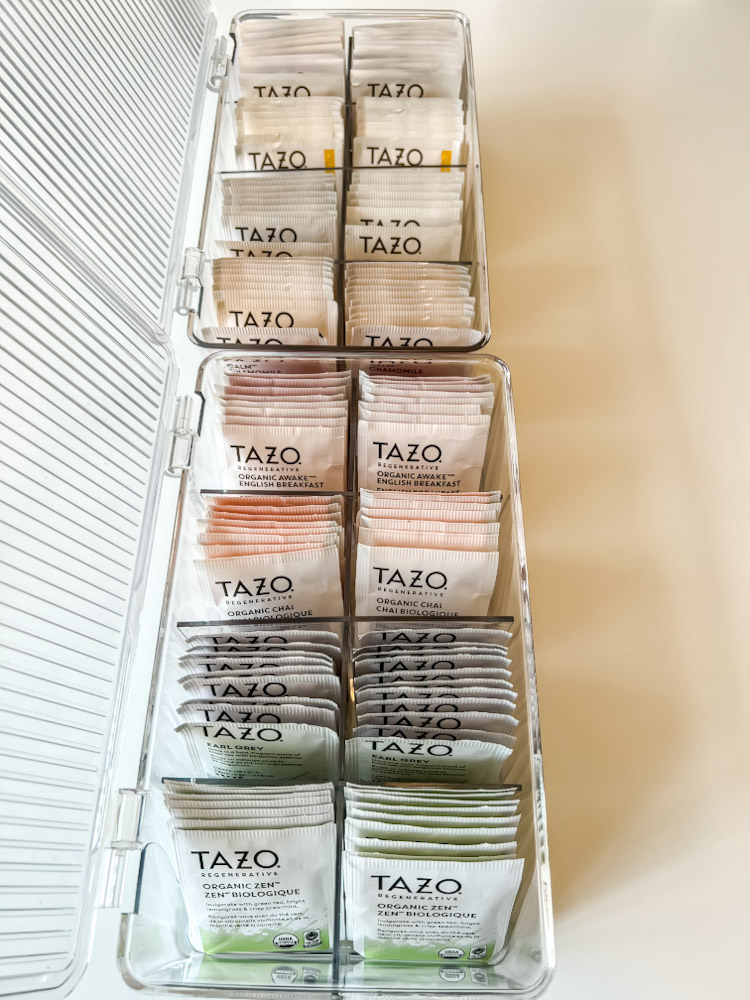 Tea organized in clear bins with lids