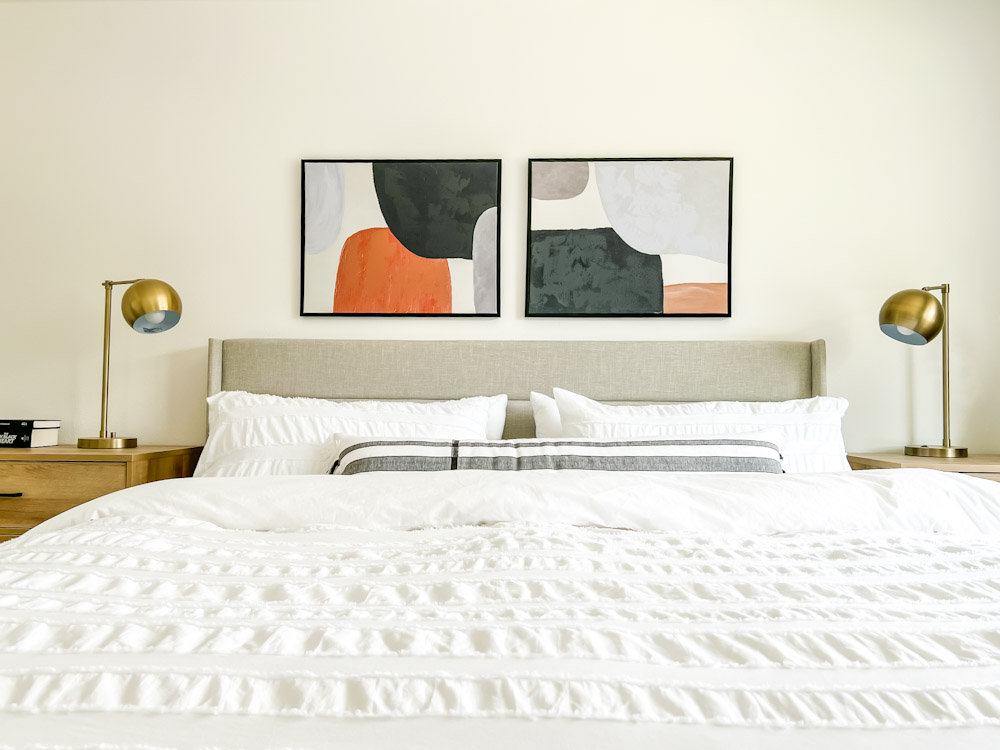 modern bedroom refresh white bedding abstract art